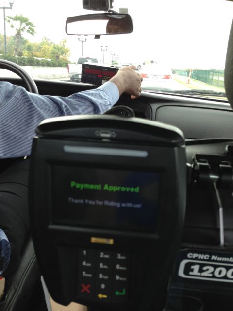 paying my cab fare while waiting in traffic at Louis Armstrong New Orleans International airport