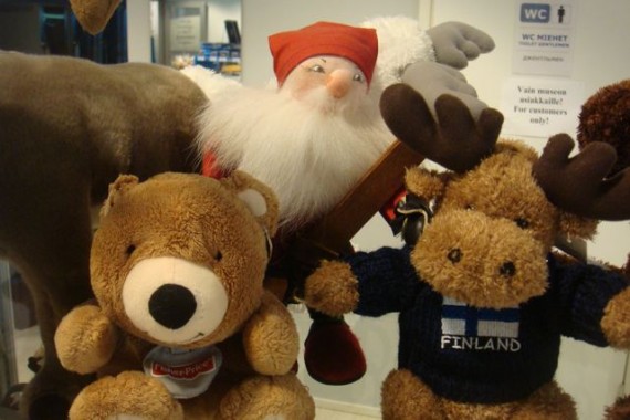 jeff noel's famous teddy bear with other stuffed animals in Finland store