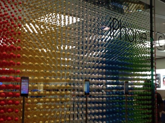 Apple Store window display of colorful beads promoting iPhone 5c