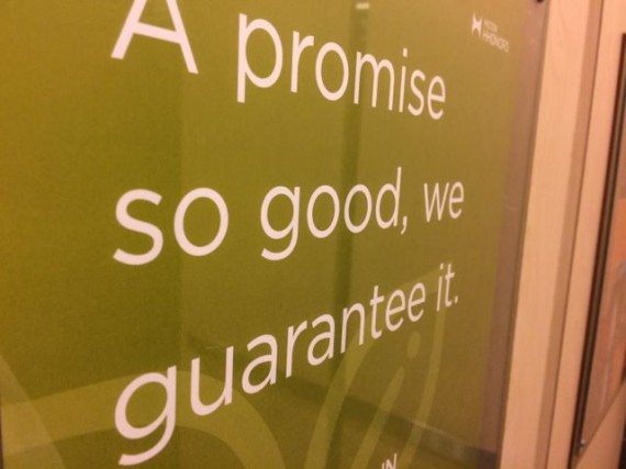 Sign with bold promise in hotel elevator 