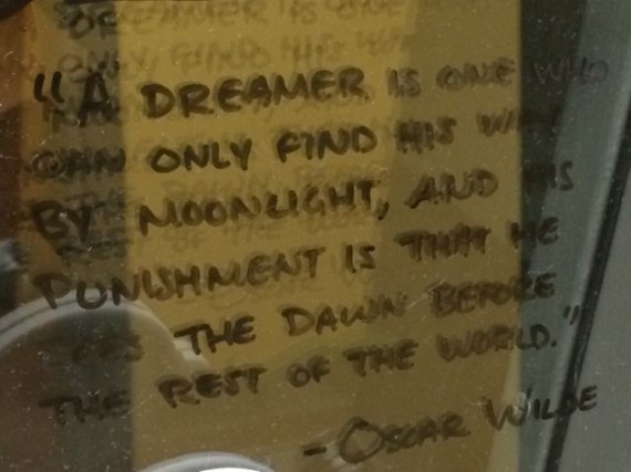 Oscar Wilde quote on office door grease board