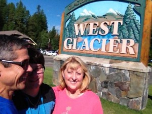 Family in front of West Glacier sign