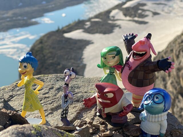 Pixar Inside Out figurines in mountain setting
