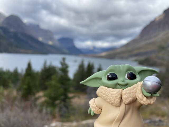 baby yoda toy in mountains