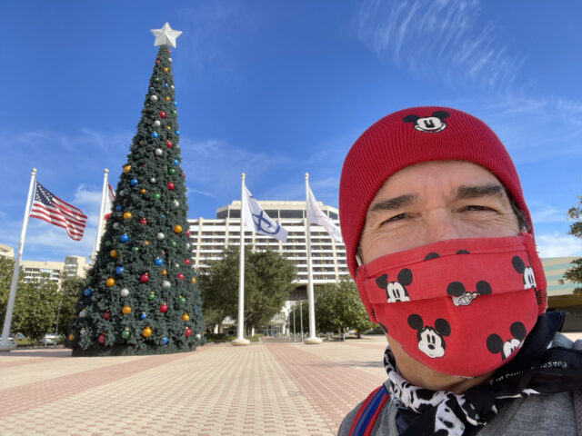 Man in a Disney mask and Disney hat at contemporary resort