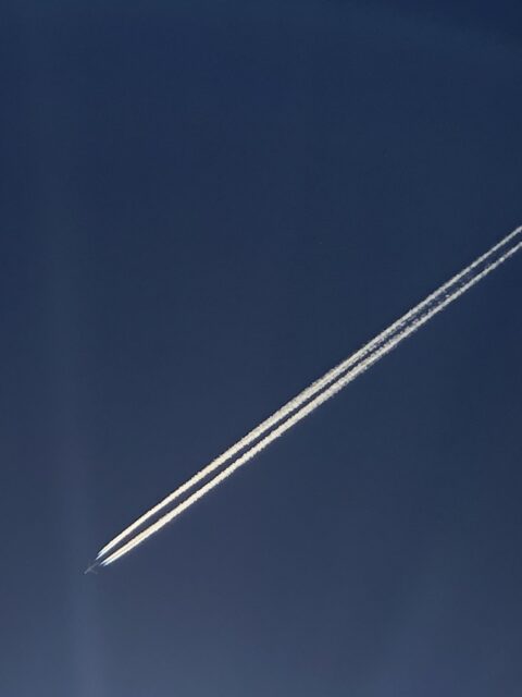 Jet flying across a blue sky