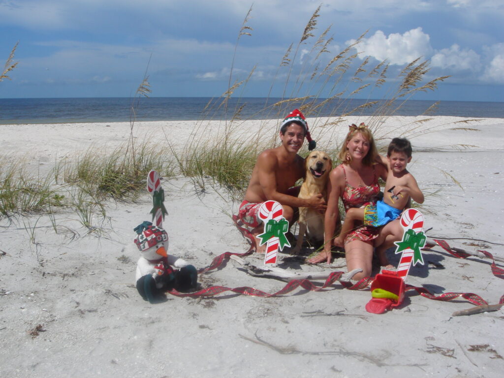 family at beach Christmas photo