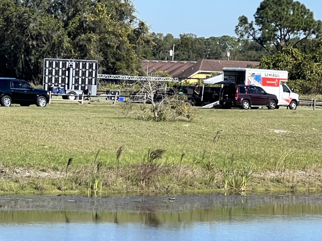 Outdoor concert stage being erected in a field