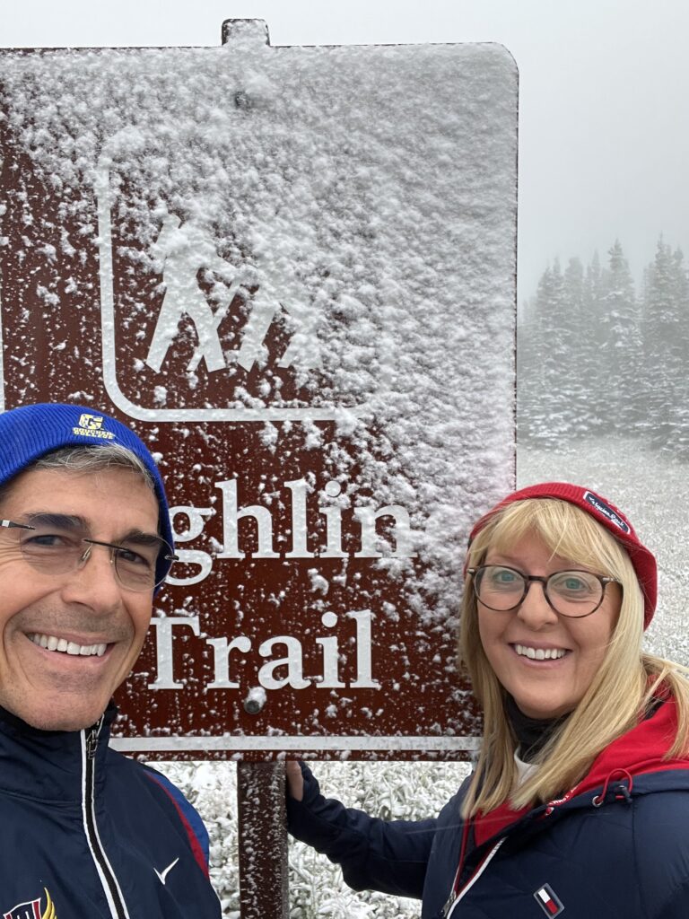Couple at trail head sign