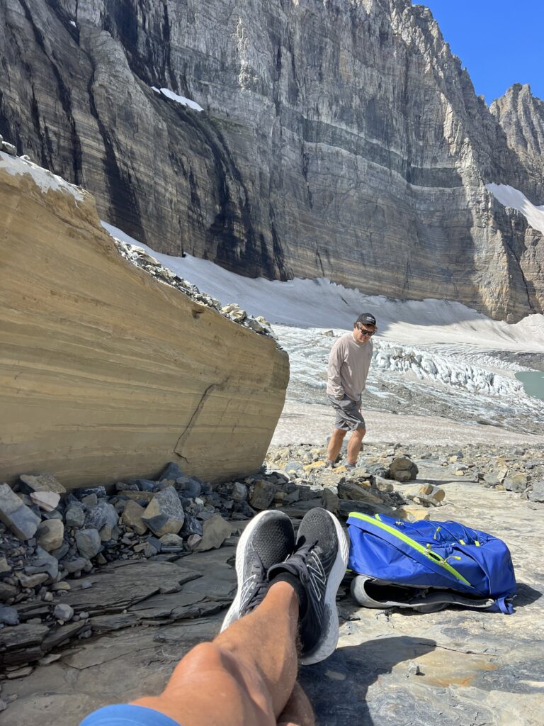 Two men next to a Glacier