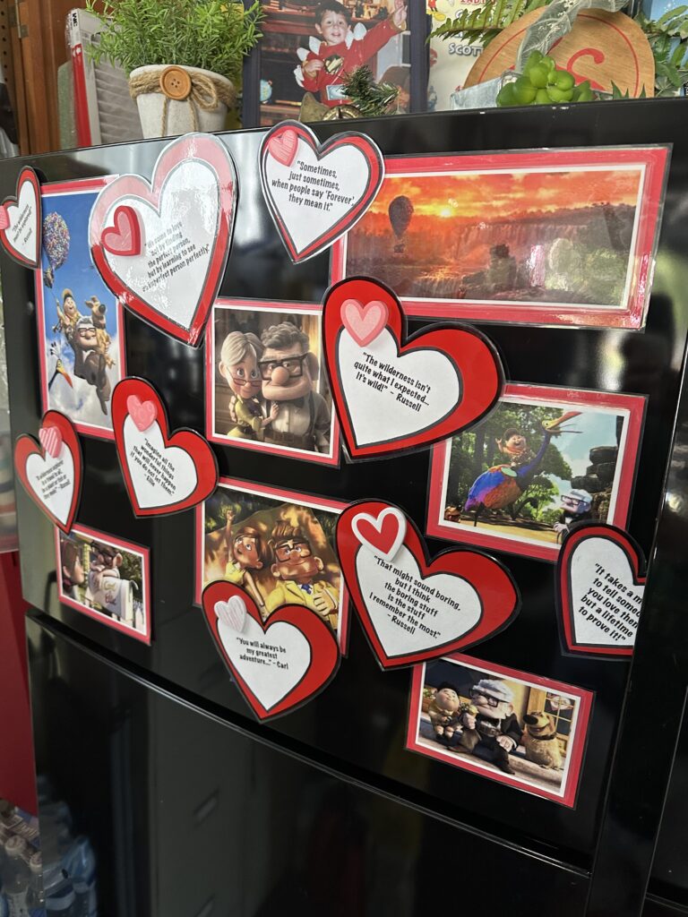 Valentines decorations on a black refrigerator 
