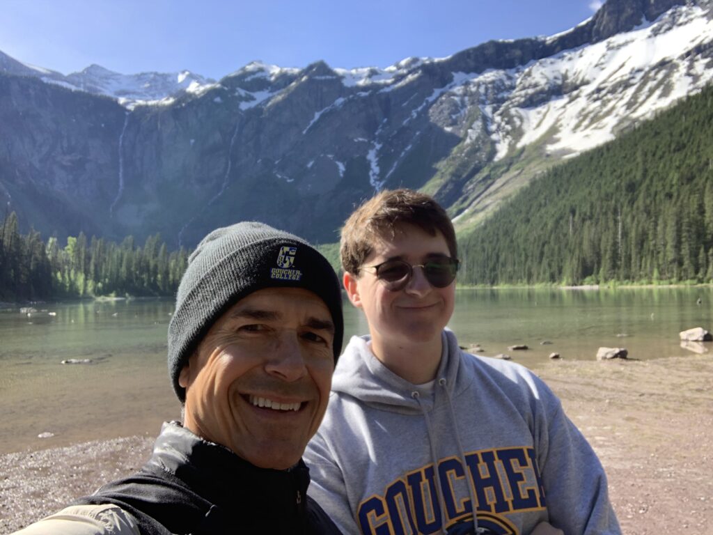 Father and son at a mountain lake