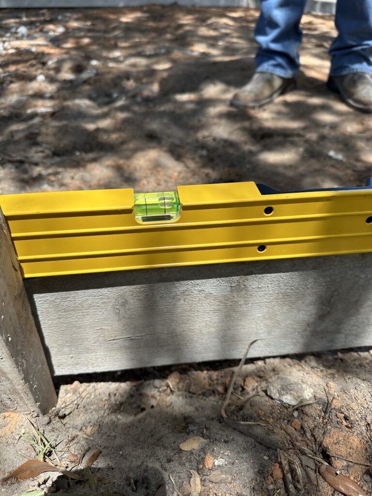 Yellow leveler on concrete forming