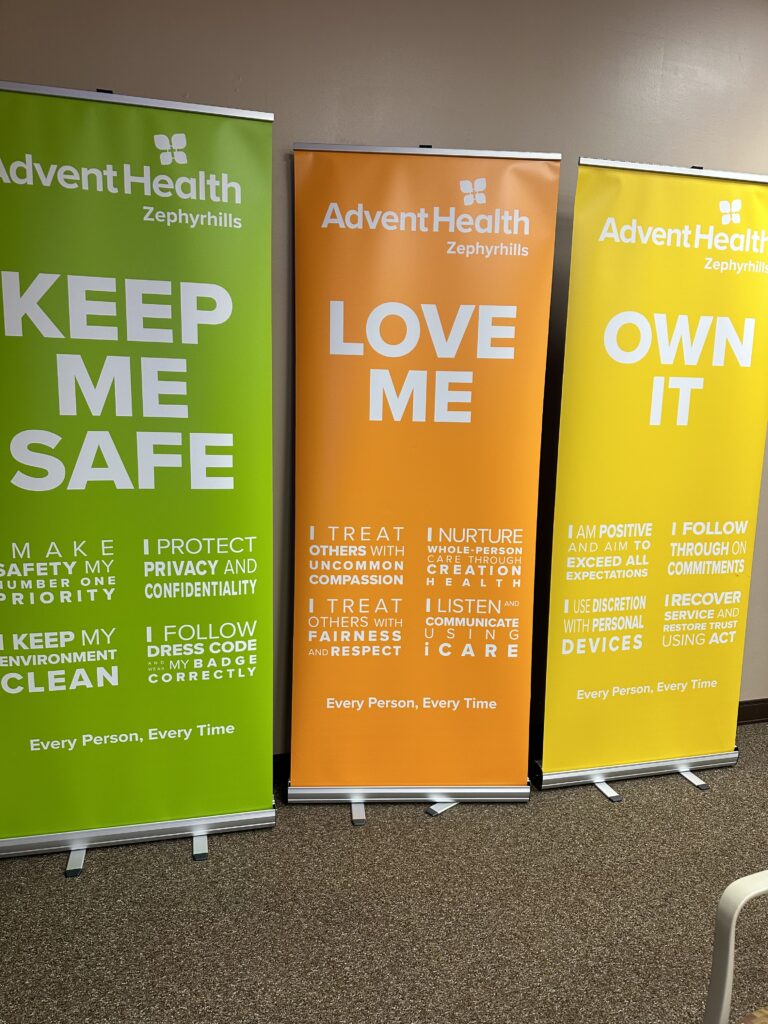 Three hospital banners in a training room