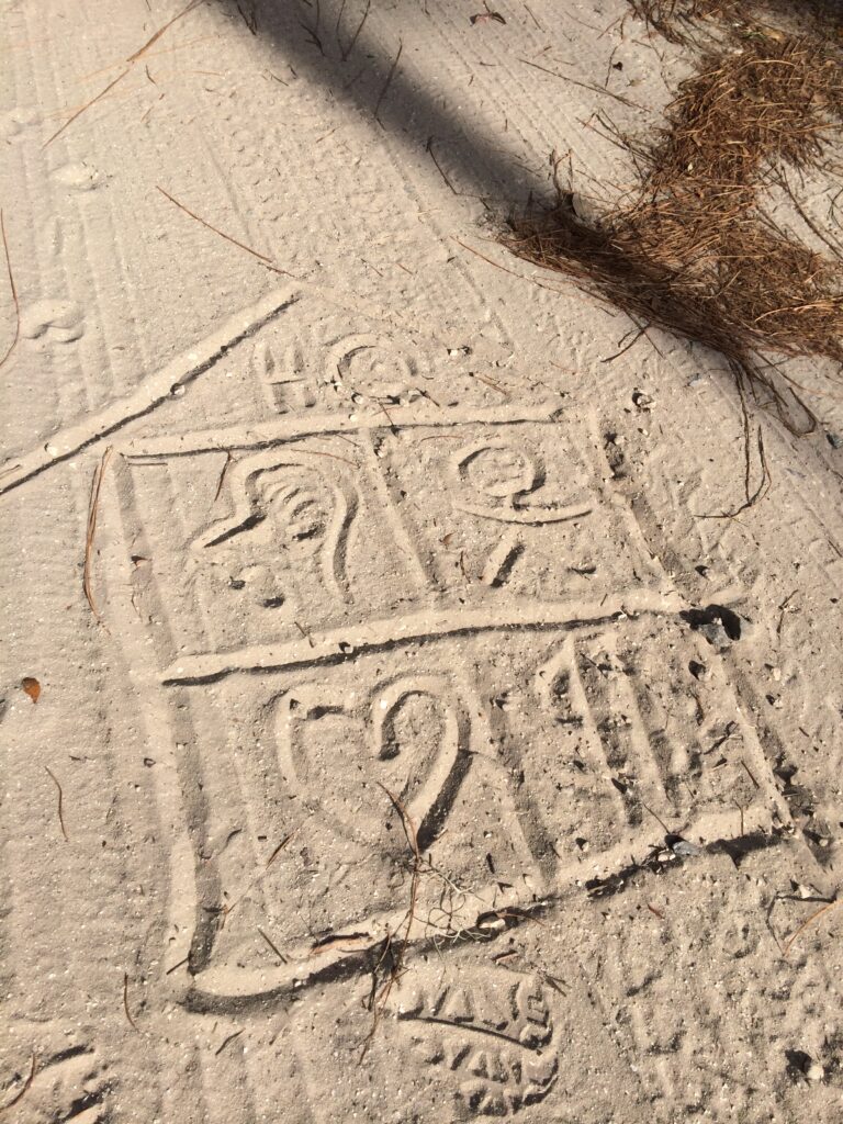 hand drawn image in the sand