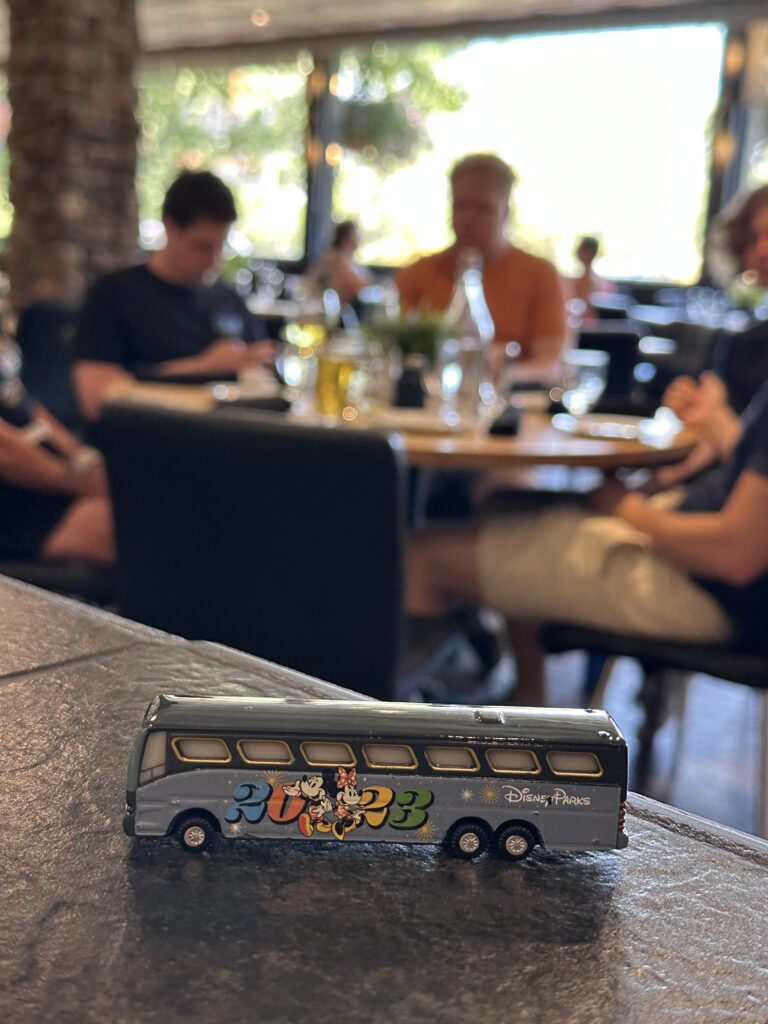 Toy Disney Bus with 2023 banner