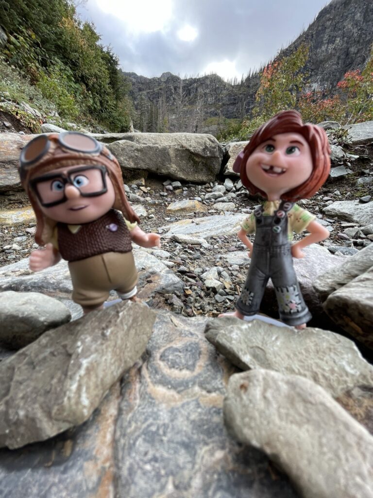 disney pixar figurines in the mountains