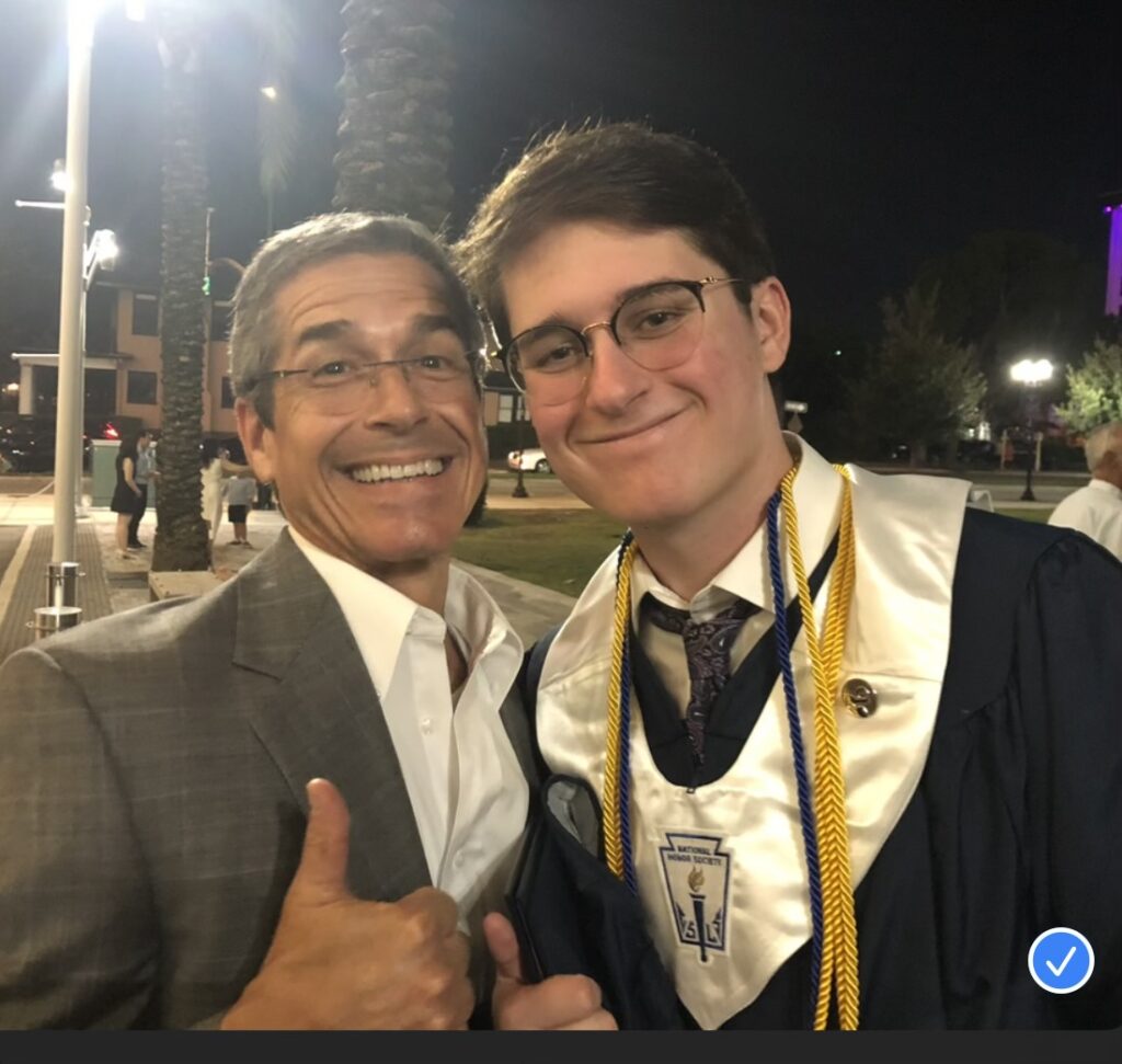 Father and son at high school graduation