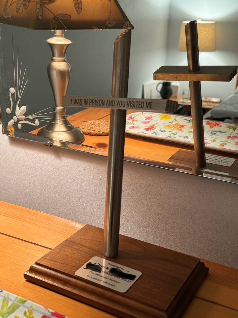 Crucifix plaque on a dresser