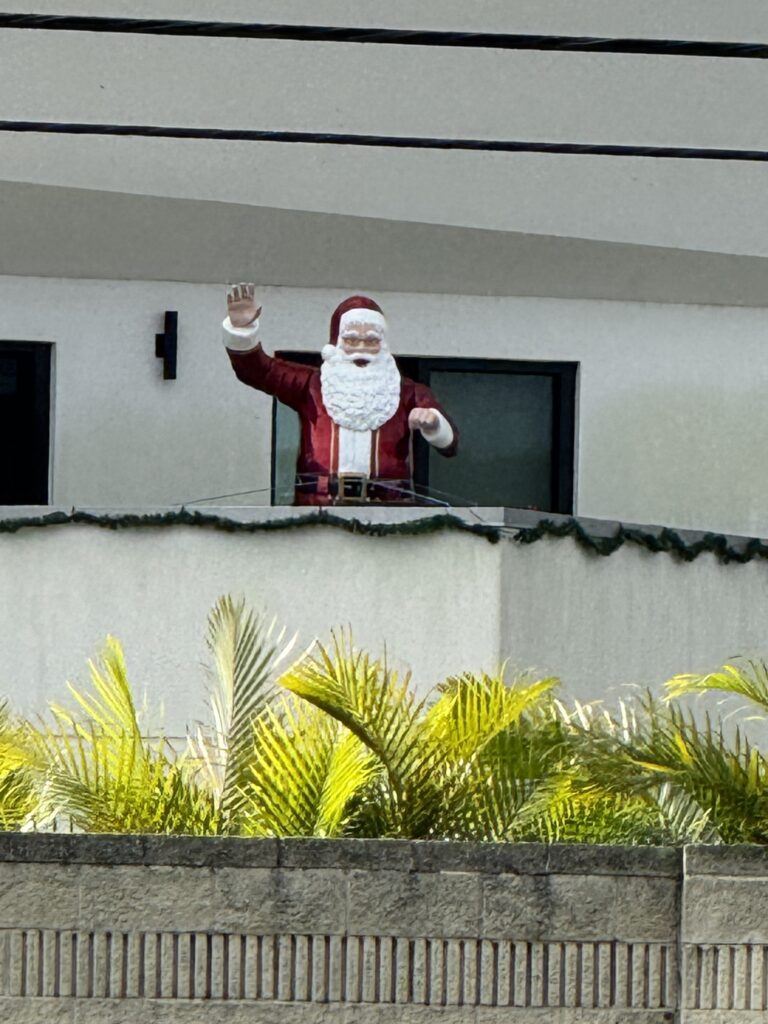 Santa character on a house deck