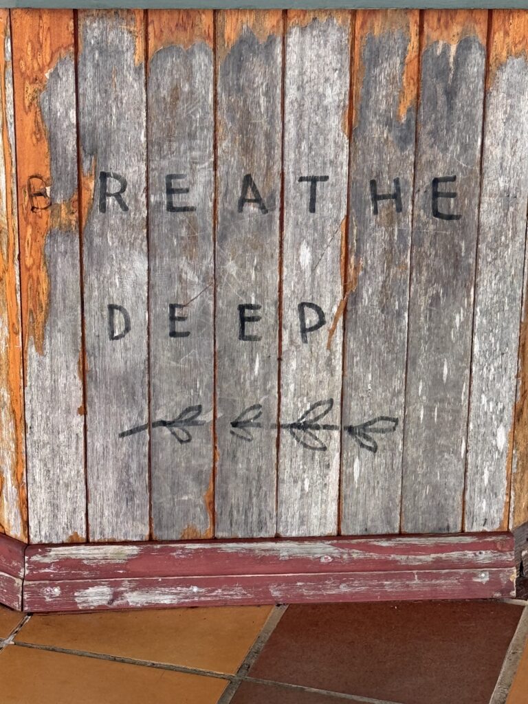 message carved into wood panel