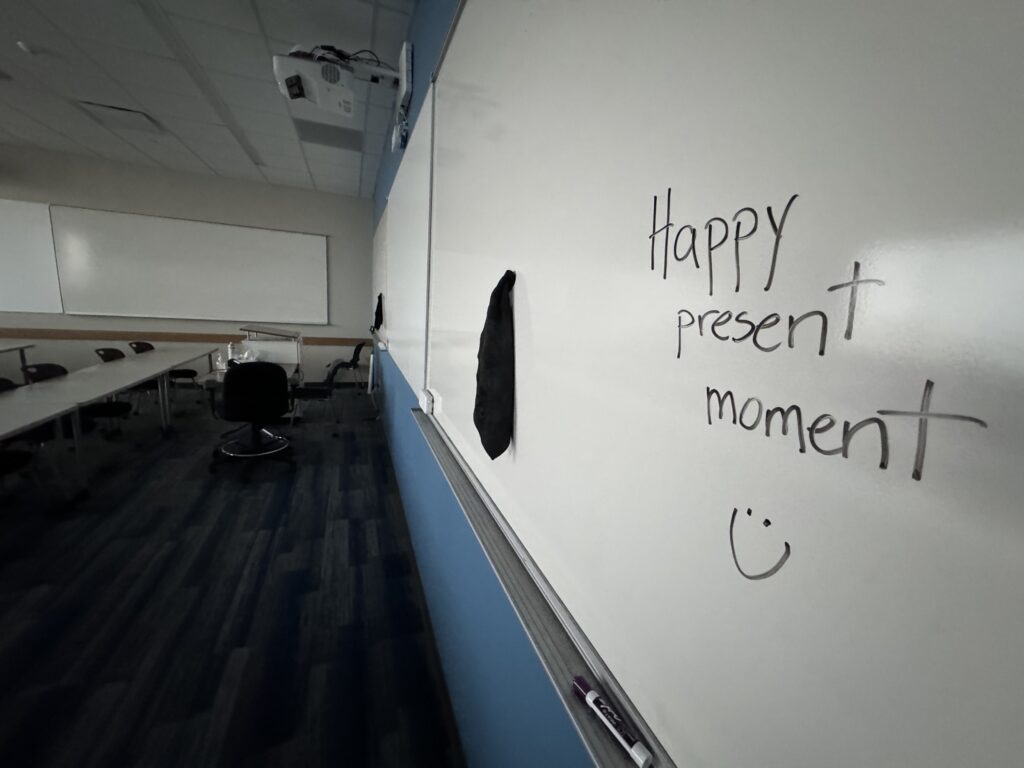 Happy Present moment written on white board 