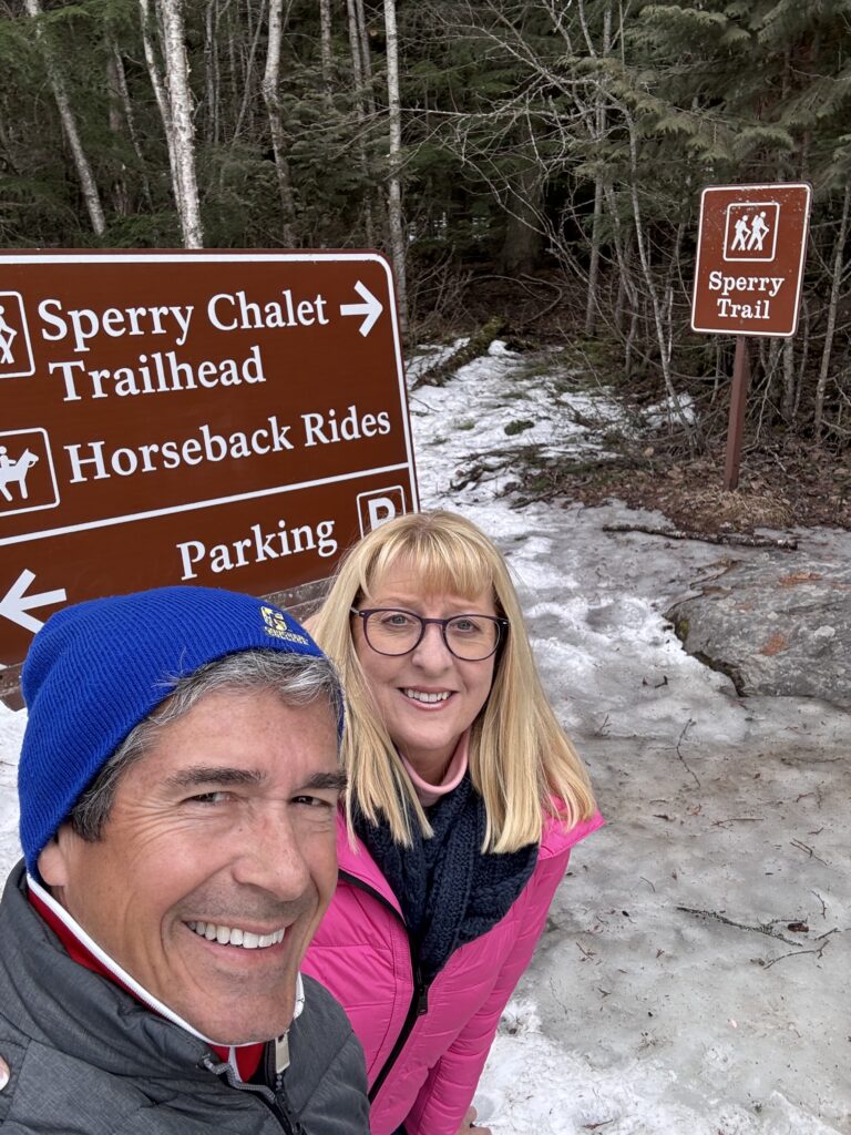 Couple at trailhead sign