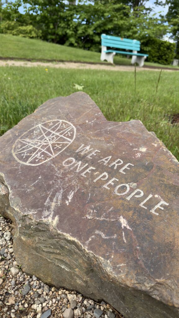 carved message on a big rock