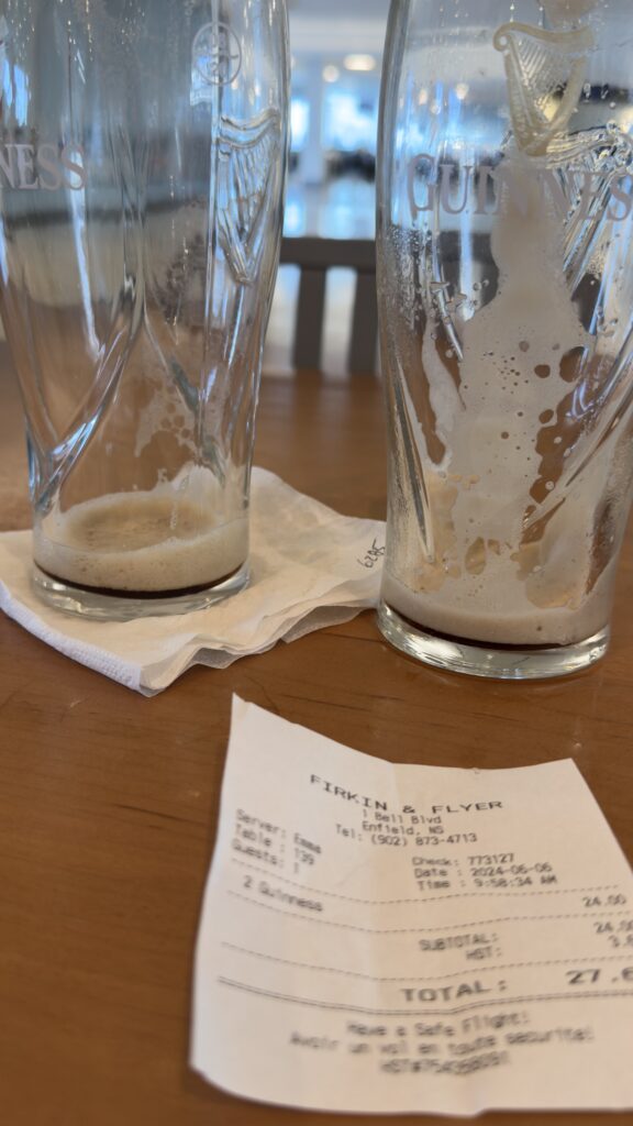 Two empty beer glasses on a table