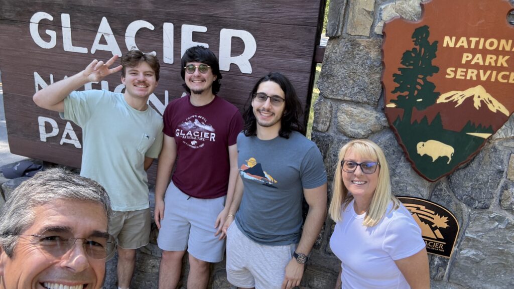 Family at National Park Sign 