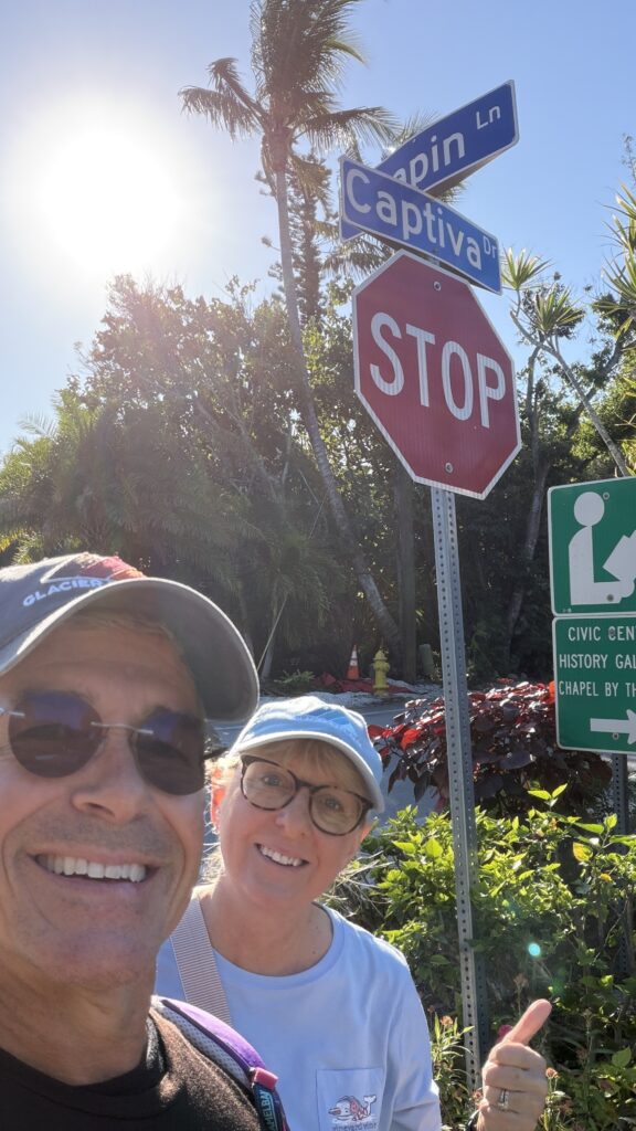 honeymoon couple posing at street sign