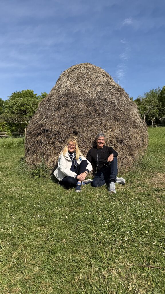 Couple sitting next to Claud Monet’s haystack 